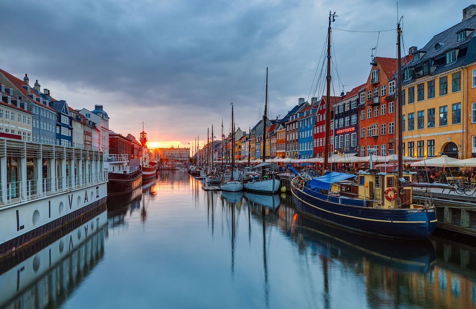 Colourful Nyhavn waterfront houses and boats in Copenhagen