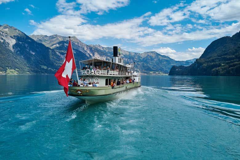 Boat cruising on a calm Swiss alpine lake