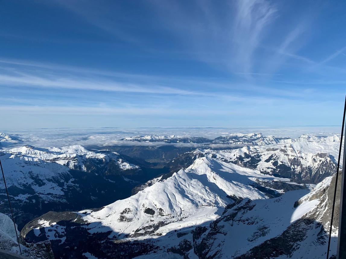 Panoramic view of snow-covered Alps from the summit