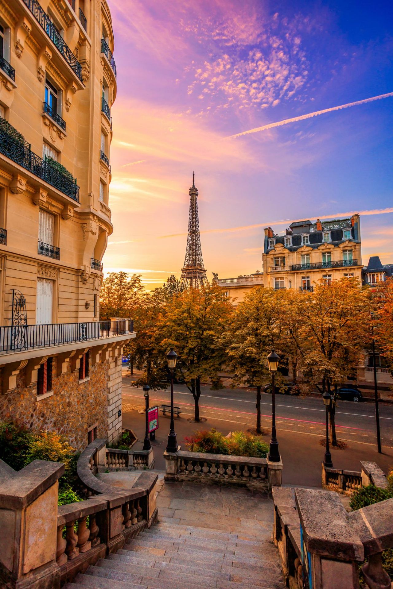 Eiffel Tower from a Parisian street at sunset